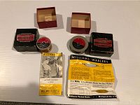 Two original Williams Duro-Lus metallic trolling fishing line boxes alongside two vintage Williams fishing lure packages (Action-Tested Lures and Williams Wablers). One lure package is sealed; both line boxes show vintage label wear.