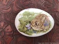 Close-up of top view showing rabbit design on the porcelain egg.