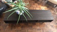 Top view of dark brown wood console showing rectangular shape and surface finish.