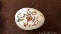 Top view of the small porcelain egg showing floral design