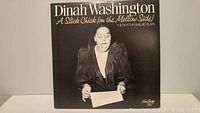 Front view of the album cover showing Dinah Washington with title and subtitle 'A Slick Chick (on the Mellow Side)'