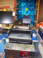 Sam4s SPS-520 register on table with Dell monitor behind