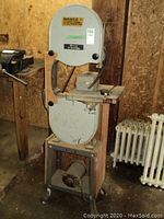 Full view of floor-standing Rockwell band saw on wooden base