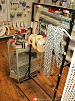 Plastic cart, metal rack, chain, spools and tools overview