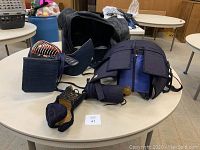 Full Kendo bogu armor set laid out on table including Men, Do, Kote, carrying bag and other accessories.