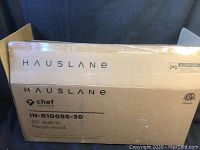 Box showing brand, series, and model of the range hood (Hauslane Chef Series IN-R100SS-30). 30 inch built-in range hood, new in box.