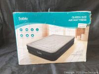 Boxed Sable queen size air mattress in teal box with product image and branding.