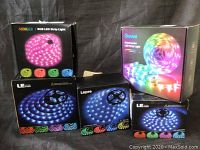 Photo showing 5 boxes of RGB LED strip lights from various brands including Govee, Lepro, LE Ever, Minger
