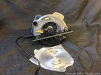 Full side view of the Tesco circular saw showing laser guide, power cord, and sealed blade packaging.