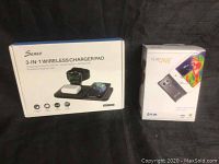 Photo showing the Seneo 3-in-1 wireless charger pad box and Flir One thermal imaging camera box side by side.