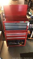Front view of closed red Stanley rolling tool chest showing all drawers