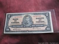 Front view of 1937 Canadian two dollar banknote showing full details including portrait and signatures.
