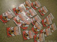 Collection of 15 Boston Red Sox pins from 2004, still sealed in original packaging with team logo and player portraits visible.