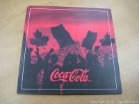 Front cover of Coca-Cola 2002 Olympic Hockey coins album, red and black with crowd and Canadian flags