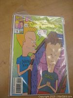Beavis and Butt-Head Comic Issue #2 cover featuring both characters with a coffin, vivid colors, and comic title text in yellow starburst