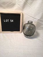 Show full vase next to lot number sign for scale and presentation.