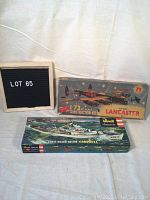 Two vintage model kits in original boxes: Airfix Avro Lancaster and Revell Coast Guard Cutter.