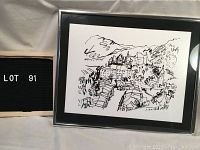 Framed original ink drawing showing the full village scene with black frame and matting.