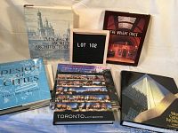 All seven large, illustrated coffee table books arranged together, showing spines and cover details.