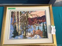 Full front view of framed winter landscape painting showing composition and frame