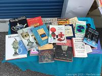 21 assorted books related to glassware, ceramics, antiques, and collectibles shown on a surface