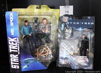 Photo showing the two Star Trek action figures in original packaging: Mr Spock from The Original Series 2013 on left, Commander Deanna Troi from First Contact 1996 on right.