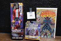 Photo showing the Star-Lord Titan Hero Series figure, Ronan and Star-Lord mini figure set, and Guardians of the Galaxy comic book together.