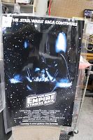 Full view of the laminated vintage Star Wars The Empire Strikes Back poster inside protective covering, showing the main artwork and text.