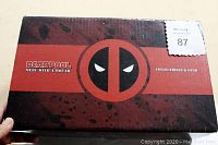 Photo of the front of the sealed Deadpool Merc With a Mouth collectibles and gear box showing the logo and labeling