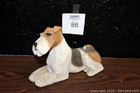 Front angle view of wire haired fox terrier figurine, showing detailed fur texture and coloration.