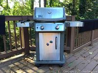 Front view of Weber Spirit two-burner gas grill on deck