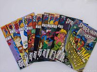 Photo of multiple Spider-Man 2099 comics fanned out showing covers with Spider-Man and related characters