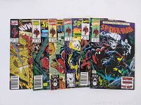 Six Spider-Man comic books arranged in a fan layout showing front covers with Todd McFarlane style artwork and Marvel branding.