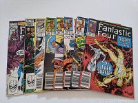 Lot of 8 Fantastic Four comic books arranged in a fanned out fashion, showing front covers and various issues.