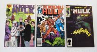 Three comic books laid out side by side showing full front covers.