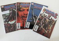 Four Marvel Zombies 3 comic books issues 1 through 4 laid out side by side showing covers with detailed zombie character illustrations.