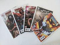 Five Marvel Zombies 4 comics including issues 1-4 and one variant cover issue, arranged fanned out with full covers visible.