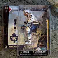 Tie Domi Toronto Maple Leafs McFarlane Series 5 action figure in original packaging showing front of box and figure in skating pose with hockey stick.