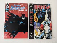 Photo of front covers of two Batman Detective Comics comic books: Annual 2 and Issue 625 with illustrated covers as described.