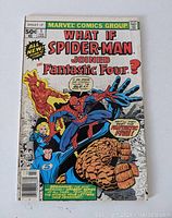 Front cover of the comic showing Spider-Man in Fantastic Four suit with other Fantastic Four members and title What If Spider-Man Joined Fantastic Four?