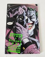 Front cover of Batman The Killing Joke 1st print comic book showing Joker holding a camera with title and creators' names.