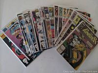 Overview of the 26 comics in the lot arranged side by side, showing a spread of cover arts predominantly featuring The Punisher logo and character.