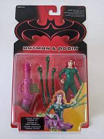 Front view of 1997 Kenner Batman & Robin Poison Ivy figure sealed in original packaging. Shows figure with vine accessories and large purple weapon inside clear blister pack on red and black Batman & Robin branded card.
