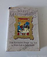 Front cover of the Marvel Masterworks hardcover comic book with visible wear and tear on the top edge of the dust jacket.