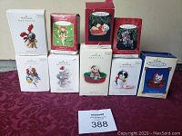 Photo of ten boxed Hallmark Christmas ornaments with varying animal and holiday-themed designs