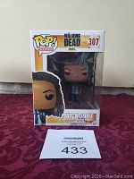 Photo of boxed Funko Pop! figure depicting Michonne from The Walking Dead, number 307.