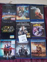 Photo of 9 Blu-ray movie cases arranged in a grid showing movie titles and cover art.