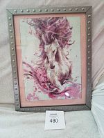 Framed diamond painting of a horse featuring flowing pink mane, displayed upright on a fabric surface with the lot number card visible.