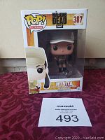 Photo showing front view of the unopened Funko Pop! vinyl figure boxed packaging featuring Rosita character from The Walking Dead TV series, numbered 387.