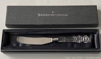 Waterford Crystal branded box containing the butter cutter knife with crystal handle and stainless steel blade.